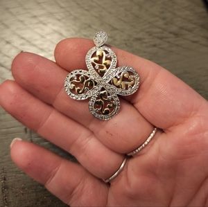 10k solid white and yellow gold pendant with diamond accent bail.